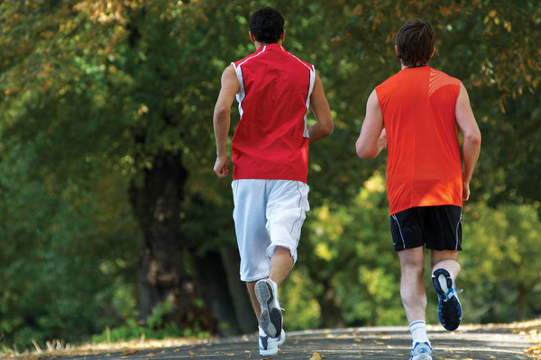 Backside view of joggers running